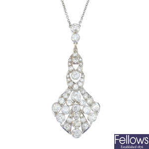 An Art Deco platinum diamond pendant, on chain.