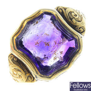 A late Victorian gold amethyst carved intaglio signet ring.