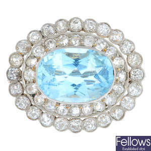 An early 20th century aquamarine and diamond cluster brooch.