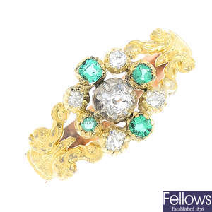 A diamond and emerald dress ring.