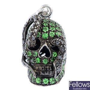 THEO FENNELL - an 18ct gold tsavorite garnet and 'black' diamond 'Skull and Snake' charm.