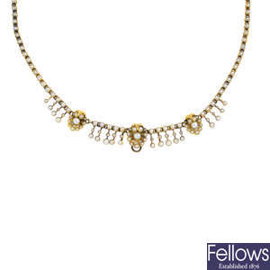 An early 20th century gold seed and split pearl necklace.