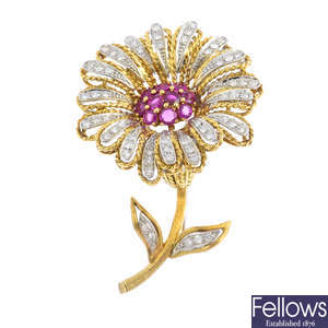 A mid 20th century gold diamond and ruby gerbera daisy brooch.