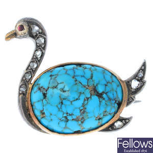 An early 20th century silver and gold, turquoise, diamond and ruby swan brooch.