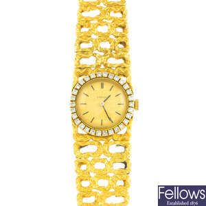 OMEGA - a lady's 1960s 18ct gold diamond cocktail watch.