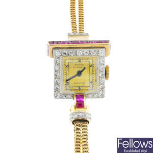 A lady's mid 20th century gold diamond and ruby cocktail watch.