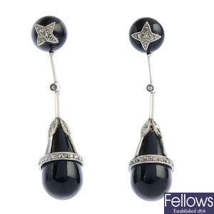 A pair of early 20th century onyx and diamond earrings.