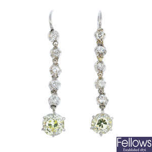 A pair of diamond dropper earrings.