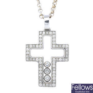 CHOPARD - an 18ct gold 'Happy Diamonds' cross pendant, with chain.