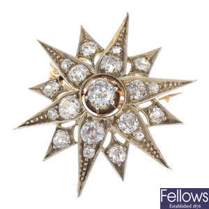 A late Victorian silver and gold star brooch.