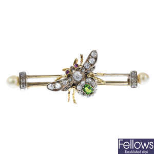 A late Victorian silver and gold, diamond and gem-set bee brooch.