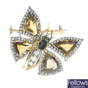 A diamond, smokey quartz, peridot and emerald butterfly brooch, set en tremblant.