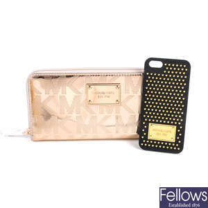 MICHAEL KORS - a wallet and a phone case.