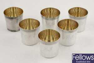 A set of six modern silver shot cups in leather case. 