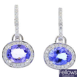 A pair of tanzanite diamond earrings.
