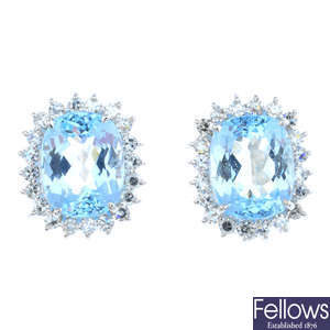 A pair of 14ct gold topaz and diamond cluster earrings.