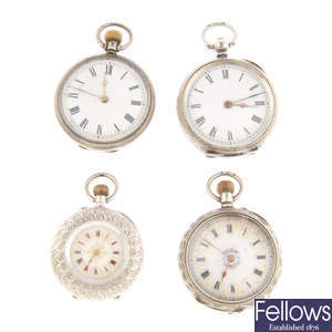 A group of four assorted white metal pocket watches.
