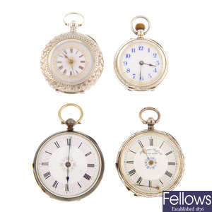 A group of four assorted white metal pocket watches.