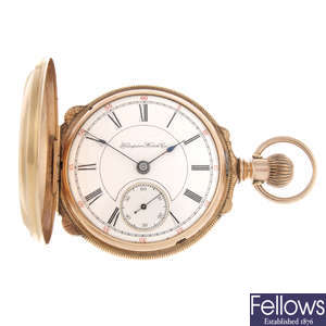 A gold plated full hunter pocket watch by Hampden Watch Co. with two full hunter pocket watches.