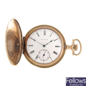 A gold plated full hunter pocket watch by Elgin with two full hunter pocket watches.