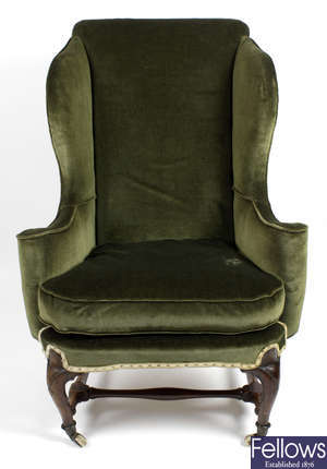 A 19th century wing back arm chair.