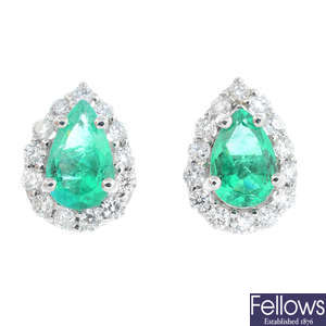 A pair of Colombian emerald and diamond cluster earrings.