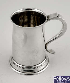 A 1930's plain silver mug.