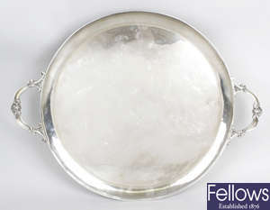 A 1930's silver large twin-handled salver of circular form.