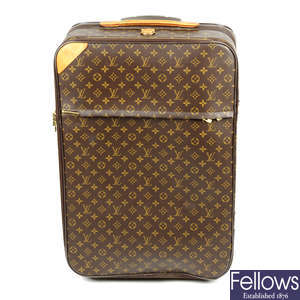 LOUIS VUITTON - a Monogram Pégase 65 rolling suitcase. AF.