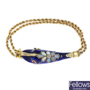 An opal, diamond and garnet, enamel snake bracelet.