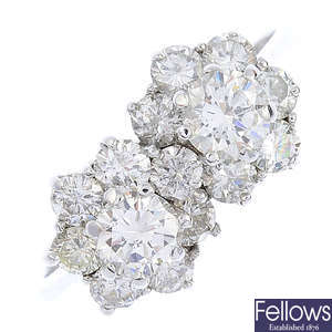 An 18ct gold diamond double cluster ring.