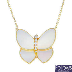 VAN CLEEF & ARPELS - a diamond and mother-of-pearl butterfly pendant, on chain.