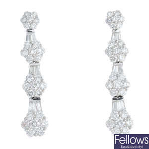 A pair of 18ct gold diamond floral cluster earrings.