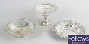 A late Victorian embossed silver dish, plus a small Edwardian tazza dish & a further footed dish. (3).