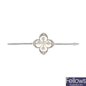 An early 20th century 15ct gold and platinum pearl and diamond bar brooch.