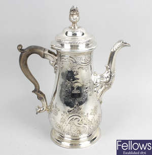 A George II silver coffee pot. 