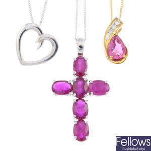 A 9ct gold ruby cross pendant, a 9ct gold tourmaline and diamond pendant and a heart pendant, with chains.