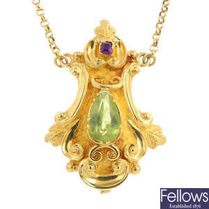 A peridot and ruby pendant, on chain.