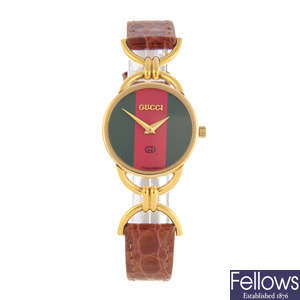 GUCCI - a lady's gold plated 6000L wrist watch and a Gucci 3000M wrist watch.
