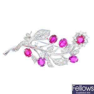 A ruby and diamond floral and foliate brooch.