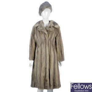 A rare sapphire mink coat with matching hat and two other fur items.