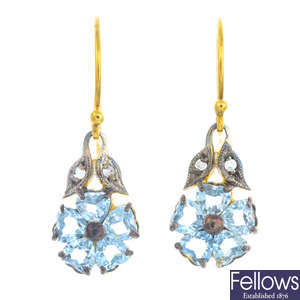 A pair of topaz and diamond earrings.