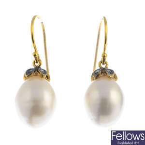 A pair of diamond and pearl earrings.
