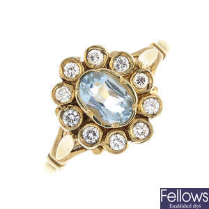An 18ct gold aquamarine and diamond floral cluster ring.