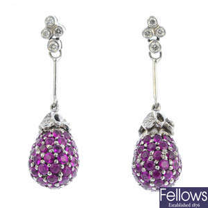 A pair of ruby and diamond earrings.