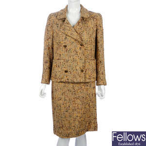 CHANEL - a beige and multicoloured boucle wool skirt suit.