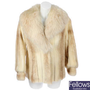 A two-tone mink jacket with fox fur collar.
