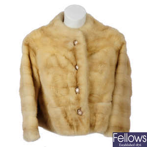 A collarless mink jacket.