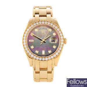 ROLEX - an 18ct yellow gold Oyster Perpetual Day-Date Pearlmaster bracelet watch.