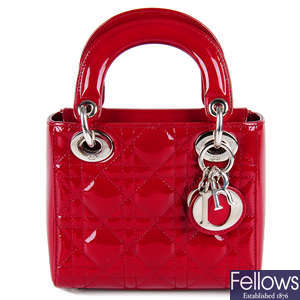 CHRISTIAN DIOR - a patent maroon Mini Cannage Lady Dior handbag.
